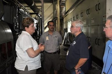 Earthquake ^ Flooding ^ Tsunami - Pago Pago, American Samoa, November 14, 2009 -- Nancy Ward, administrator of FEMA Region IX, and Denis Coliten, FEMA's infrastructure branch director for the earthquake, tsunami and flooding disaster in American Samoa, discuss the replacement of the Satala power generation plant, which was inundated by eight feet of sea water. Theodore L. Leiato, power generation manager for the American Samoan Power Authority, rear, conducted the tour of the ruined facility. Michael H. Smith, right, FEMA's deputy federal coordinating officer was among participants. Richard O'Reilly/FEMA.