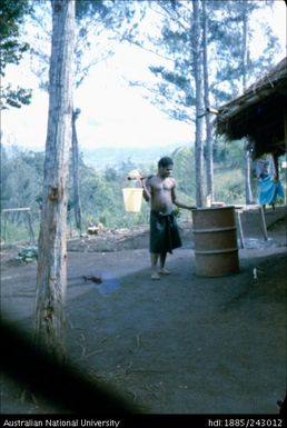 Male carrying water buckets