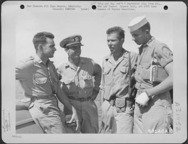 On their way to shore at Los Negros, Admiralty Islands, aboard a crash boat, the rescued flyers of the 394th Bomb Squadron, 5th Bomb Group, who were shot down while on a mission over Yap Islands in the Caroline Group, chat over their experiences. (U.S. Air Force Number 68140AC)