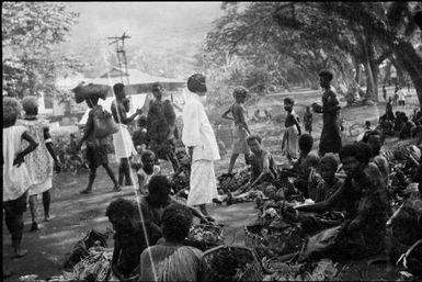 Native market before trestle tables introduced, Rabaul, New Guinea, ca. 1929 / Sarah Chinnery