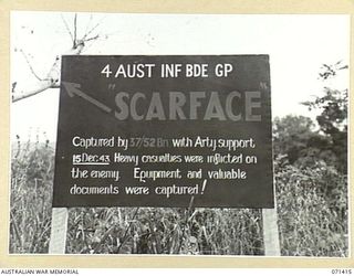 SCAR FACE FINSCHHAFEN AREA, NEW GUINEA. 1944-03-21. THE BATTLE SIGN MARKING THE CAPTURE OF SCAR FACE BY THE 37/52ND INFANTRY BATTALION, 4TH INFANTRY BRIGADE GROUP SUPPORTED BY ARTILLERY. THE ARROW ..