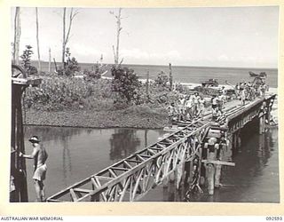 SOUTH BOUGAINVILLE. 1945-05-27. THE SAVIGE BRIDGE OVER THE JABA NO. 1 RIVER NEARING COMPLETION. CONSTRUCTED BY MEMBERS OF 11 FIELD COMPANY ROYAL AUSTRALIAN ENGINEERS, IN FIVE WEEKS, THE BRIDGE ..