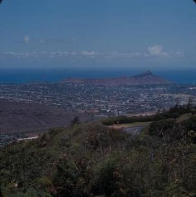 [Landscape city filled valley and distant coast at Diamond Head, United States]