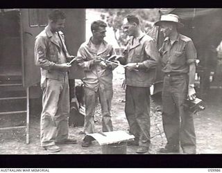 PORT MORESBY, NEW GUINEA. 1943-11-14. TEST PHOTOGRAPH TAKEN BY WARRANT OFFICER R. IRVING OF THE MILITARY HISTORY SECTION SHOWING THREE UNITED STATES SOLDIERS AND SERGEANT R. J. BUCHANAN, ..