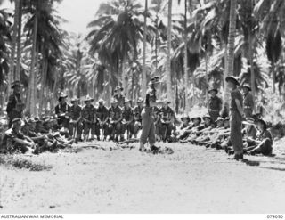 SIAR, NEW GUINEA. 1944-06-20. PERSONNEL OF THE 58/59TH INFANTRY BATTALION ATTENDING A LECTURE DURING A CADRE COURSE FOR NON COMMISSIONED OFFICERS. IDENTIFIED PERSONNEL ARE:- V504642 PRIVATE D.J. ..