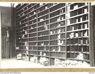 PORT MORESBY, NEW GUINEA. 1943-12-07. BINS IN THE ORDNANCE STORE OF THE NO. 3 SUB DEPOT, 10TH AUSTRALIAN ADVANCED ORDNANCE DEPOT