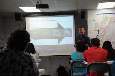 Paul Parsons Jr. explains the Assessment process at an DCMP training at the ARC.