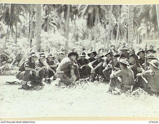 SIAR, NEW GUINEA. 1944-06-20. TROOPS OF A COMPANY, 58/59TH INFANTRY BATTALION, RECEIVING INSTRUCTION OF THE CARE AND MAINTENANCE OF THE BREN LIGHT MACHINE GUN. IDENTIFIED PERSONNEL ARE:- VX147105 ..