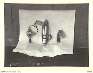 LAE, NEW GUINEA. 1944-07-04. CAPTURED JAPANESE RADIO VALVES ON DISPLAY AT THE INTELLIGENCE BRANCH, HEADQUARTERS, NEW GUINEA FORCE