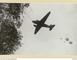 NEW GUINEA, 1943-08-01. "KAI" OR "BISCUIT" BOMBERS WERE USED TO CARRY SUPPLIES OF FOOD AND AMMUNITION TO FORWARD TROOPS IN INACCESSIBLE AREAS. NOTE - KAI IS THE NATIVE WORD FOR FOOD. PHOTOGRAPH ..