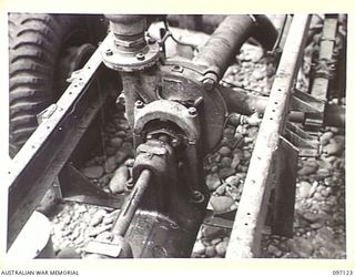 NADZAB, NEW GUINEA. 1945-09-14. THE CLOSE UP OF A MOBILE PUMP IN USE AT 8 INDEPENDENT FARM PLATOON. IT SHOWS THE CENTRIFUGAL PUMP FITTED WITHIN THE CHASSIS MEMBERS OF AN OLD FOUR-WHEEL DRIVE 3-TON ..