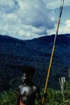 [Portrait of a man holding spear with mountain in background], Bougainville, Aug 1962