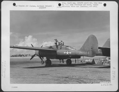 Armorers Working On Guns Of A Northrop P-61 'Black Widow'. Saipan, Marianas Islands, 19 July 1944. (U.S. Air Force Number 63621AC)