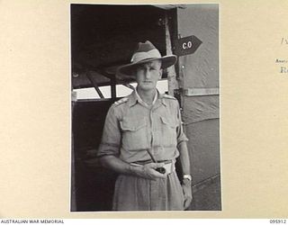 WEWAK POINT, NEW GUINEA. 1945-08-29. LIEUTENANT COLONEL W.S. HOWDEN, COMMANDING OFFICER 2/8 INFANTRY BATTALION OUTSIDE HIS OFFICE