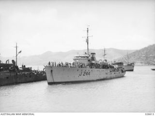 PORT MORESBY, PAPUA. 1942-09. H.M.A.S. CASTLEMAINE IN PORT MORESBY HARBOUR AFTER CONVOYING TROOPSHIPS AND SUPPLY VESSELS FROM AUSTRALIA
