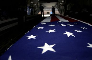 During a commemorative ceremony at Hickam Air Force Base (AFB) Hangar 35, inside a US Air Force (USAF) C-17A Globemaster III, members of a joint honor guard prepare to carry the remains believed to be of unaccounted-for Americans, recovered in Vietnam and Papua New Guinea. The remains will be taken to the Joint POW/MIA Accounting Command's Central Identification Laboratory (JPAC CIL) where they will attempt to positively identify the remains so they can be returned to their families