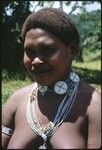 Woman's portrait, with white beads and string of girimalaile pendants