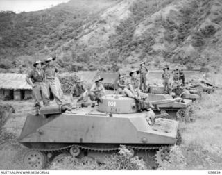 RABAUL, NEW BRITAIN. 1945-09-14. NUMEROUS TYPE 2 KA-MI AMPHIBIOUS TANKS CAPTURED AT RABAUL. RIGHT SIDE VIEW SHOWING NUMBERS ON THE TURRETS AND WITHOUT FLOTATION PODS AFFIXED (PODS AT FRONT AND REAR ..