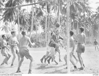 LAE, NEW GUINEA. 1944-08-19. AN EXCITING MOMENT DURING THE SOCCER MATCH BETWEEN A TEAM FROM THE HMAS "MANOORA" AND HEADQUARTERS, 5TH DIVISION DURING THE INTER-UNIT SPORTS MEETING. IDENTIFIED ..