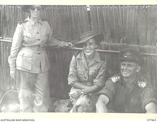 BABIANG ROAD, AITAPE, NEW GUINEA. 1944-12-04. SISTERS OF THE 104TH CASUALTY CLEARING STATION CHATTING WITH AN AUSTRALIAN ARMY OFFICER IMMEDIATELY AFTER THEIR DISEMBARKATION