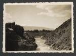 View of river and mountains, building at left, New Zealand?