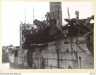 MOILA POINT, BOUGAINVILLE. 1945-09-28. BOMB DAMAGE ON BRIDGE OF THE JAPANESE MERCHANT SHIP, HITATI MARU, WHICH RAN ASHORE NEAR KANGU HILL AFTER SUCCESSFUL ATTACK BY ALLIED AIRCRAFT