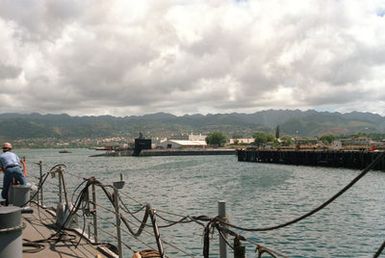A port beam view of the nuclear-powered strategic missile submarine USS HENRY M. JACKSON (SSBN-730) moored to a pier