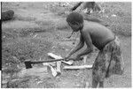 Woman chopping wood