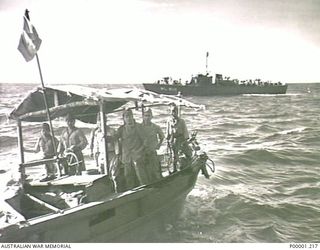 THE SOLOMON ISLANDS, 1945-08-19. THE BARGE AND CREW WHICH CARRIED AN ENVOY OF LIEUTENANT GENERAL MASATANE KANDA, COMMANDER XVII JAPANESE ARMY, FROM BUIN BAY TO HMAS LITHGOW OFF MOILA POINT, ..