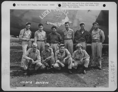 Captain Povlsen and crew of the 65th Bomb Squadron, 43rd Bomb Group, pose beside the Consolidated B-24 "Lucky Lucille" at Dobodura Airstrip, Papua, New Guinea. 26 February 1944. (U.S. Air Force Number 72365AC)