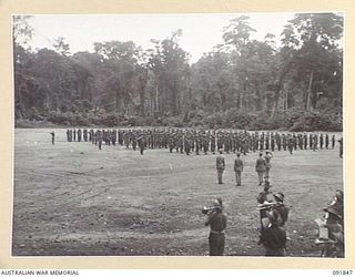 TOROKINA, BOUGAINVILLE. 1945-05-11. TROOPS OF 25 INFANTRY BATTALION (A.I.F.) ON PARADE PRIOR TO AN INSPECTION BY LIEUTENANT GENERAL V.A.H. STURDEE, GENERAL OFFICER COMMANDING FIRST ARMY