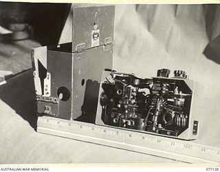 LAE AREA, NEW GUINEA. 1944-11-27. A CAPTURED JAPANESE TYPE 94 MK VI "WALKIE-TALKIE" RADIO SET IN THE MUSEUM OF THE ASSISTANT QUARTERMASTER GENERAL (E) 1ST AUSTRALIAN ARMY (BACK VIEW)