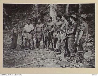 WONGINARA MISSION, NEW GUINEA. 1945-04-06. SOME OF "GODWIN'S GUERILLAS", WHO HAVE TAKEN PART IN THE FIGHT AGAINST THE JAPANESE. THESE POLICE BOYS AND NATIVE SCOUTS GUIDED 2/3 INFANTRY BATTALION ..