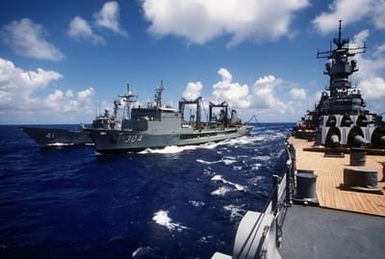 The Australian underway replenishment tanker HMAS SUCCESS (AOR-304) refuels the guided missile frigate USS MCCLUSKEY (FFG-41) and the battleship USS MISSOURI (BB-63), foreground, as the vessels take part in exercise RimPac '88 off the coast of Hawaii