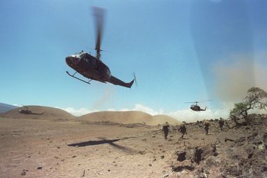 UH-1 Iroquois helicopters are used by members of Company A, 1ST Battalion, 5th Infantry, 25th Infantry Division, as they conduct an airmobile assault on opposing forces during exercise OPPORTUNE JOURNEY 4-84 at Pohakuloa Training Area
