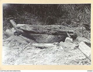 TOROKINA AREA, BOUGAINVILLE. 1945-08-12. A BUNKER AFTER BEING HIT BY THREE 75MM M6 GUN ROUNDS DURING TRIALS FOR THE WAR OFFICE OF THE M24 GENERAL CHAFFEE LIGHT TANK