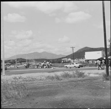 Spectators standing along the sideline during the 1st Safari Calédonien racing event, New Caledonia, 1967, 3 / Michael Terry