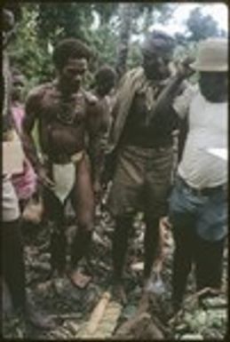 Three men, Folofo'u is the tall man