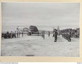 JACQUINOT BAY, NEW BRITAIN, 1945-07-03. BEFORE DEPARTING FOR BOUGAINVILLE HIS ROYAL HIGHNESS, THE DUKE OF GLOUCESTER, GOVERNOR-GENERAL OF AUSTRALIA, TAKES THE ROYAL SALUTE FROM THE GUARD OF HONOUR ..