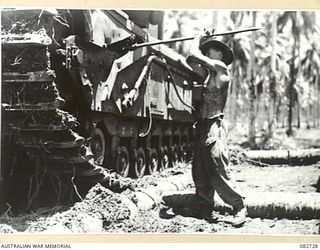MADANG, NEW GUINEA. 1944-10-12. MAINTENANCE WORK ON A TANK DURING TESTS CONDUCTED AT HQ 4 ARMOURED BRIGADE