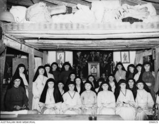 Ramale Mission, Kokopo Area, New Britain. A group of Roman Catholic Missionary sisters in the chapel section of their living quarters at Ramale Mission. They are members of a group of internees ..