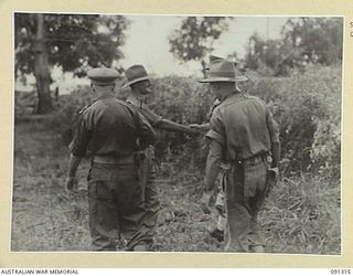 BOIKEN AREA, AITAPE-WEWAK SECTOR. 1945-04-28. LIEUTENANT COLONEL I. HUTCHISON 2/3 INFANTRY BATTALION (1), SHAKING HANDS WITH LIEUTENANT GENERAL V.A.H. STURDEE, GENERAL OFFICER COMMANDING FIRST ARMY ..