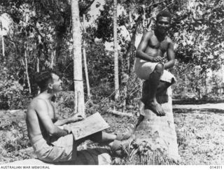 1943-02-04. NEW GUINEA. WAR ARTIST ROY HODGKINSON SKETCHES NATIVE BOY BOSKI WHO COMES FROM RABAUL. HE WAS ONE OF A NUMBER TAKEN FROM NATIVE VILLAGE BY THE JAPANESE AND MADE TO ACT AS CARRIERS IN ..