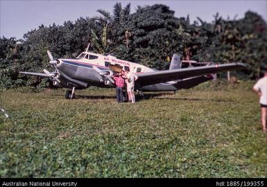 Air Melanesiae plane in field