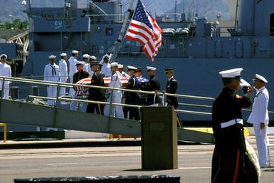 A joint service casket team carries the casket of the Unknown Serviceman of the Vietnam Era aboard the frigate USS BREWTON (FF 1086) during the designation and departure ceremony. The BREWTON will transport the Unknown Serviceman to Naval Air Station, Alameda, California