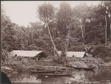 Five men with three canoes near canoe houses on the Pachu River, Choiseul, Solomon Islands, 1906 / J.W. Beattie