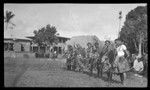 Group of men lined up in ritual activity