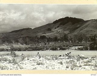 MASAWENG RIVER, FINSCHHAFEN AREA, NEW GUINEA. 1944-03-21. THE FORD AT THE MOUTH OF THE MASAWENG RIVER WITHIN THE AREA OF HEADQUARTERS, 2ND AUSTRALIAN CORPS. TANKS FROM A SQUADRON, 1ST TANK ..