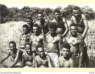 KELANOA, NEW GUINEA, 1944-03-04. MEMBERS OF "A" COMPANY, 1ST PAPUAN INFANTRY BATTALION, PICTURED AFTER THEIR RETURN FROM PATROLS IN THE WEBER POINT, TAPEN, WANDILUCK AREA. IDENTIFIED PERSONNEL ARE: ..