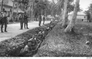 THE GARRISON AT MADANG OCCUPYING THE TRENCHES FACING THE SEA, AS NATIVES HAD REPORTED THE APPROACH OF A GERMAN CRUISER, WHICH TURNED OUT TO BE THE OILER ESCORTED BY THE "YARRA". (DONATED BY ..